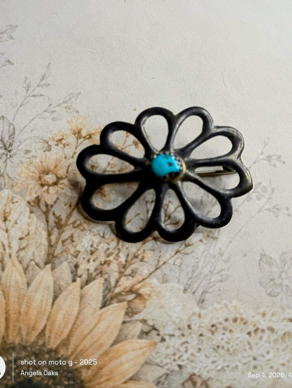 Beautiful mid-century Native American sandcast openwork flower pin.